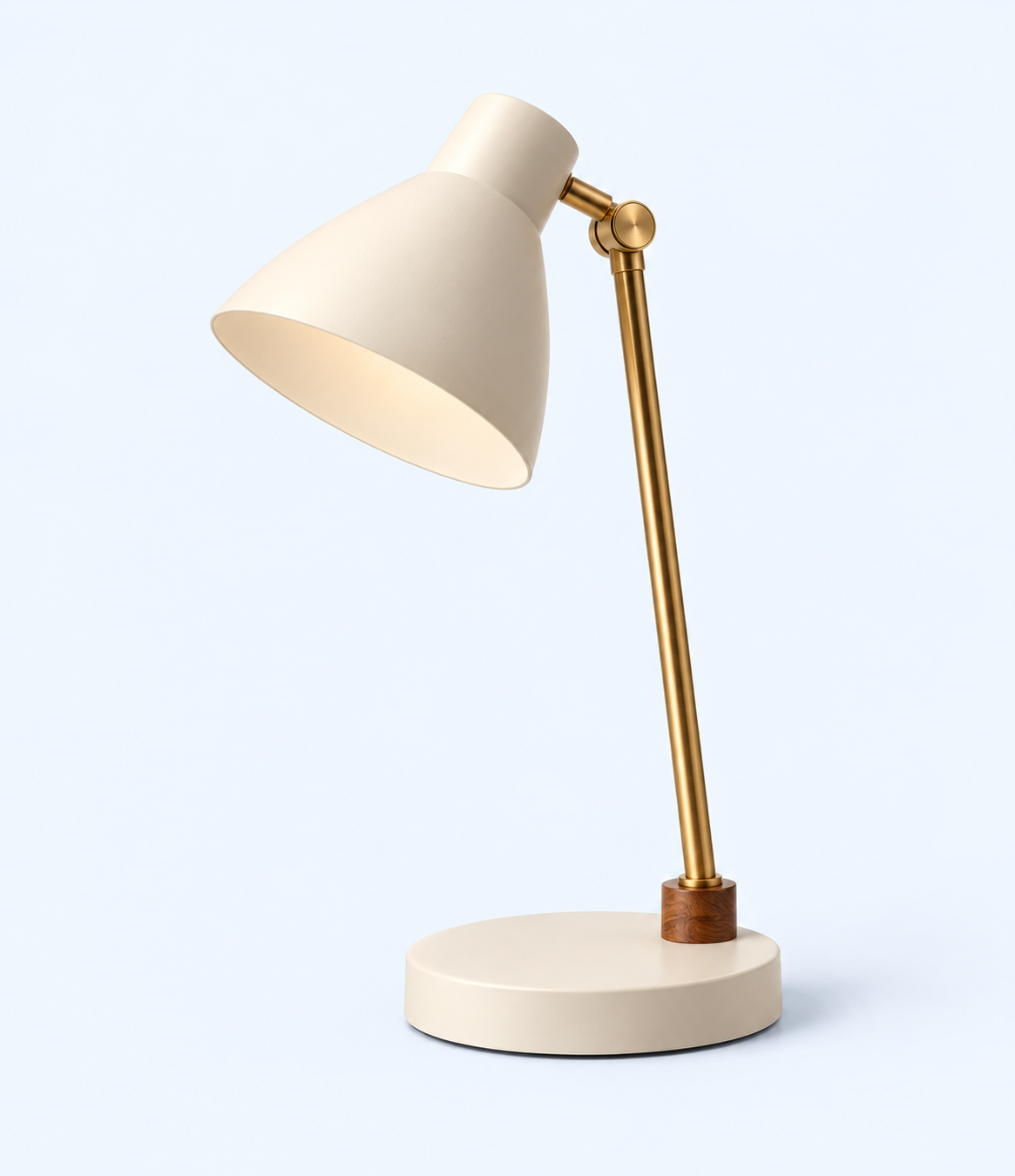 Side angled view of cream desk lamp showing shade joint and brown base collar