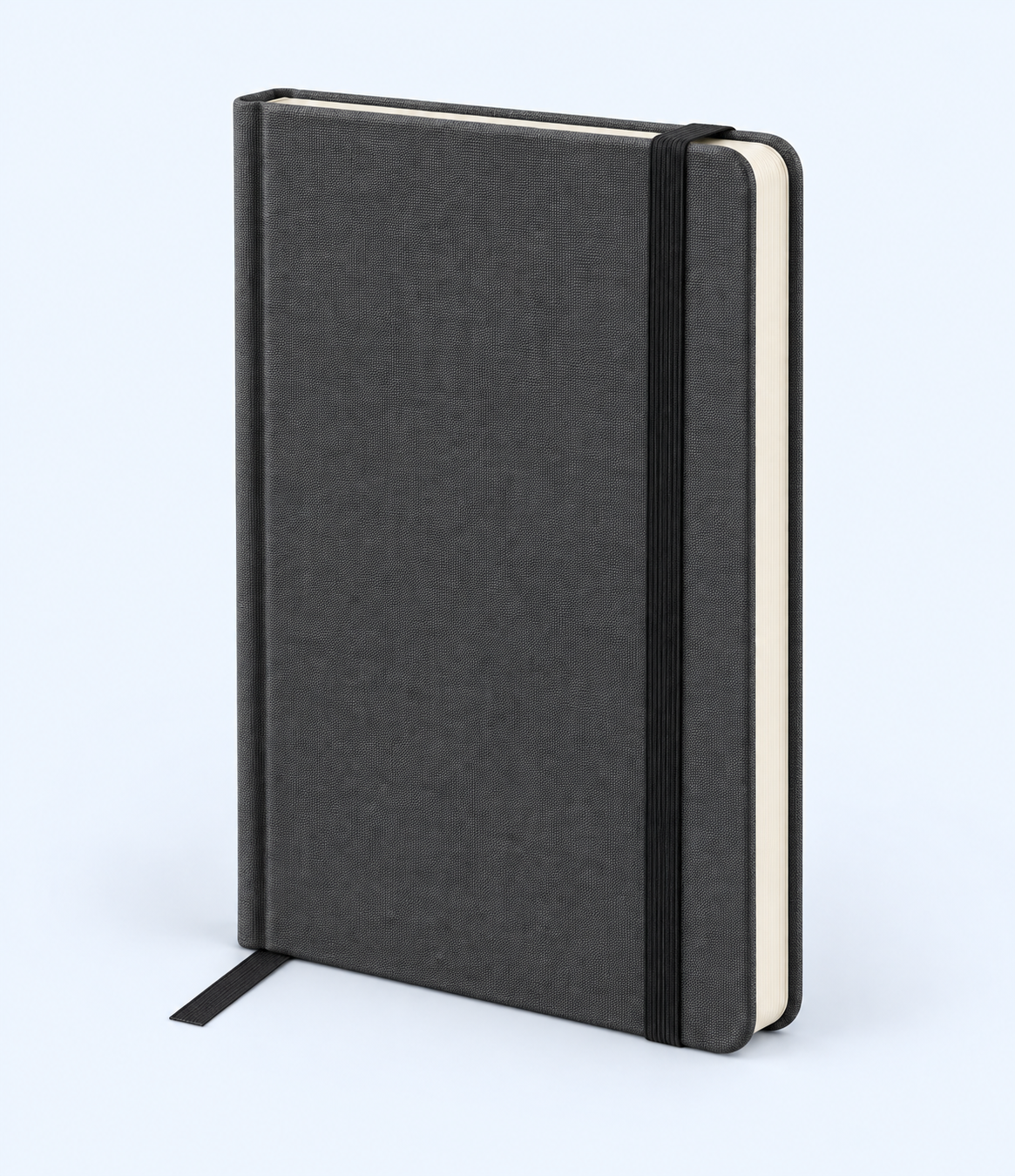 Angled view of charcoal-grey notebook showing rounded corners and light page edges