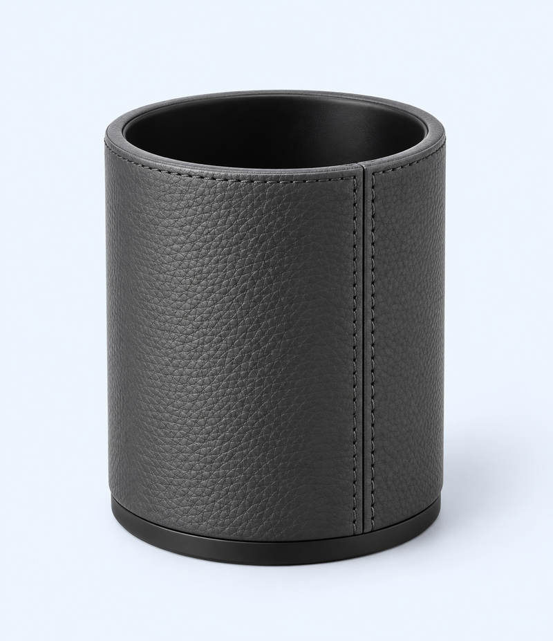 Charcoal-grey cylindrical pen holder with textured leather-look finish and stitched seam