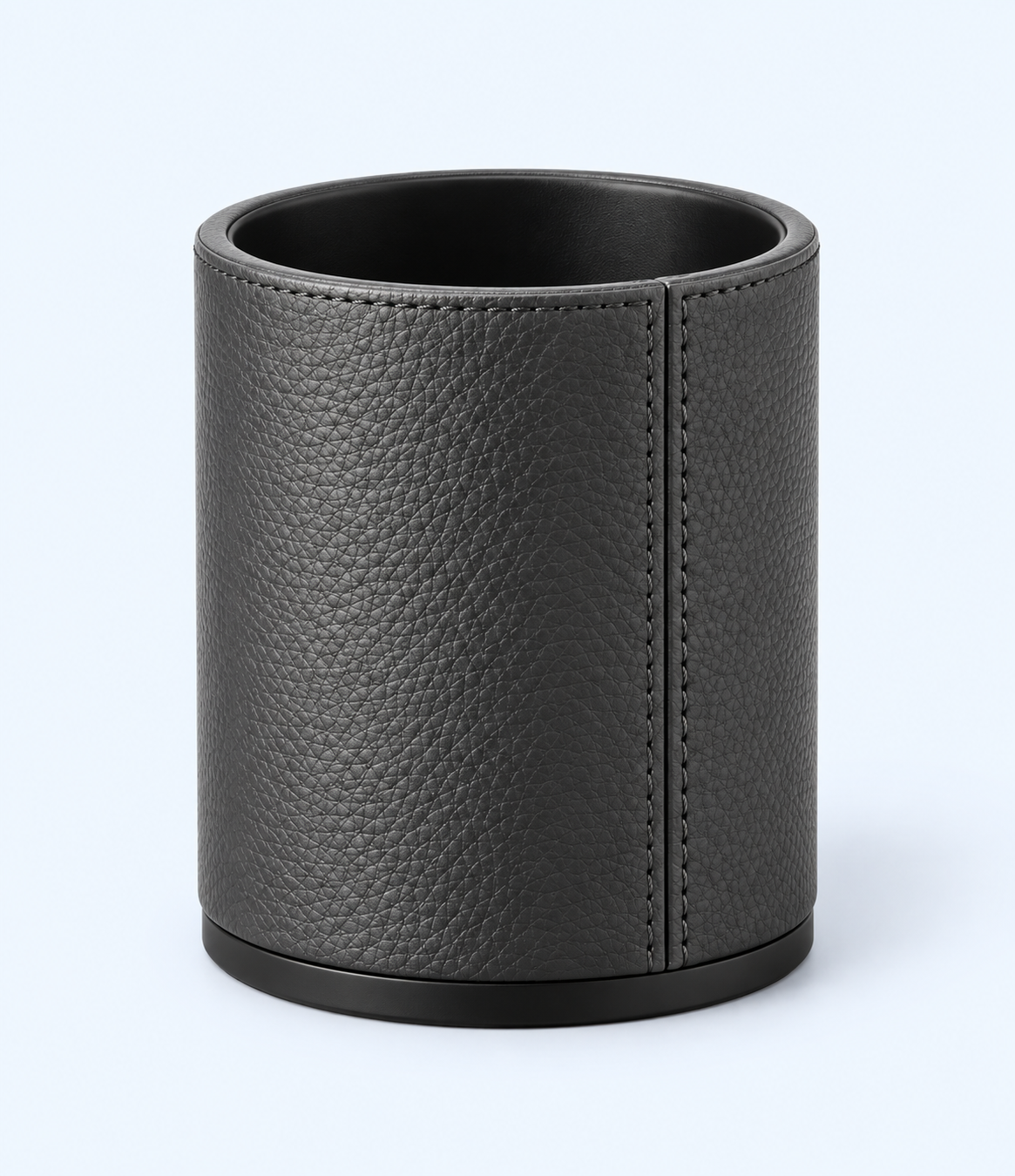 Front angled view of charcoal-grey pen holder showing black interior and base trim