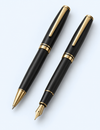 Matching black and gold-tone ballpoint and fountain pen set